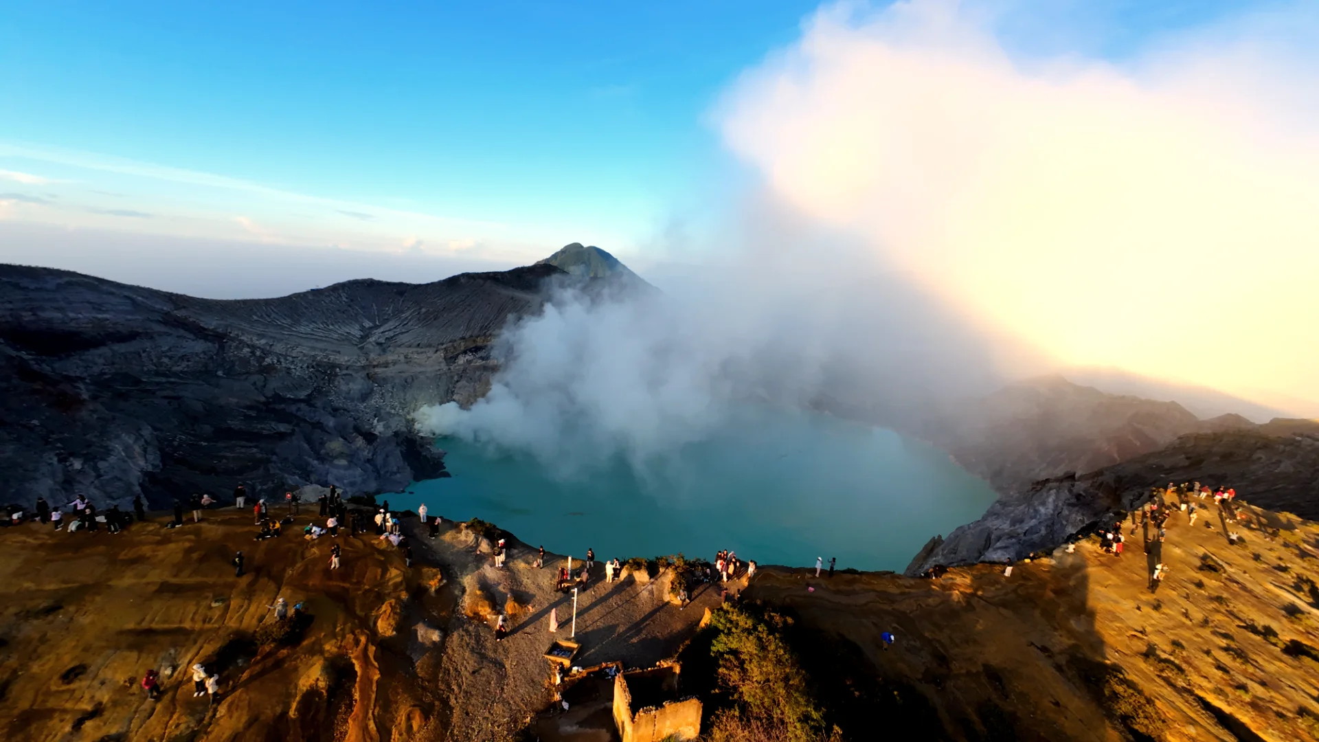 ijen crater photography tips for landscape enthusiasts - Hero View - Aerial panoramic view of the turquoise acid lake and volcanic rim of Ijen Crater