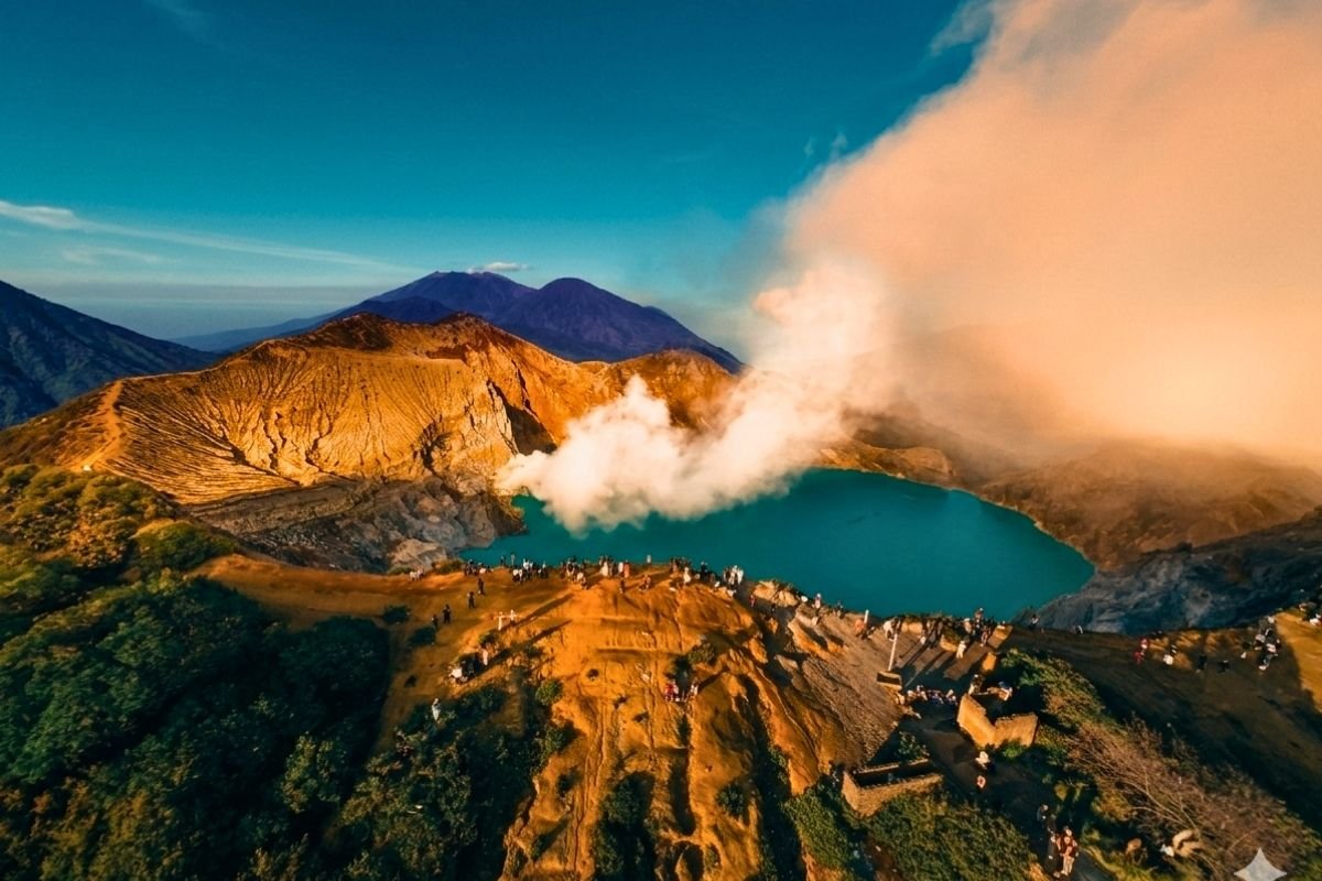 Thick volcanic sulfur gas rising from the vents of Ijen Crater at night