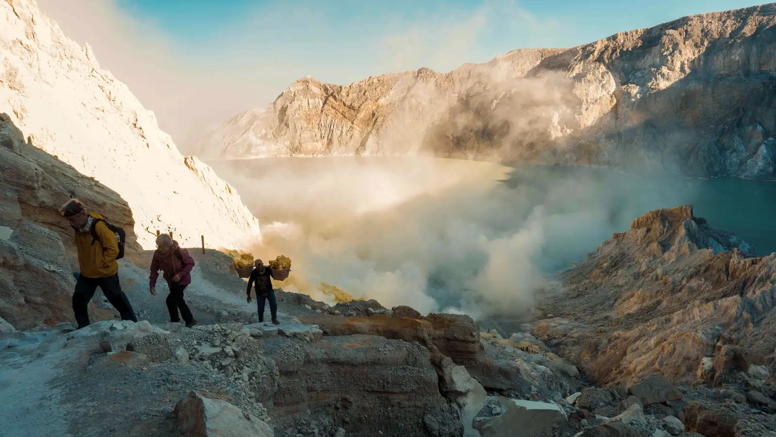Stunning sunrise view of the turquoise acid lake at Ijen Crater East Java