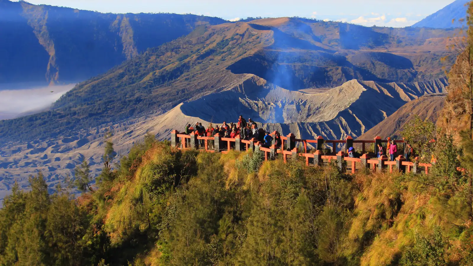 Travelers hiking the stairs to Mount Bromo crater