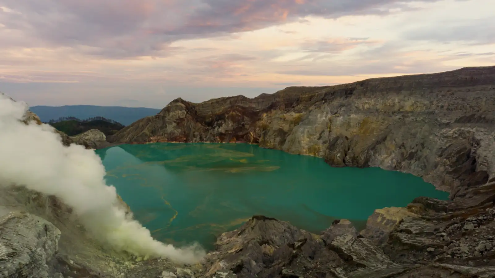 The turquoise acidic lake of Ijen Crater during the early morning