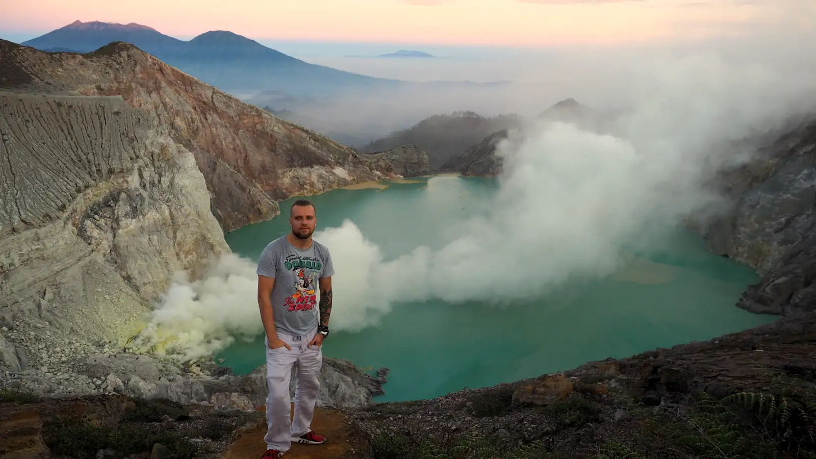 Travelers hiking the steep trail toward the Ijen Crater summit in East Java
