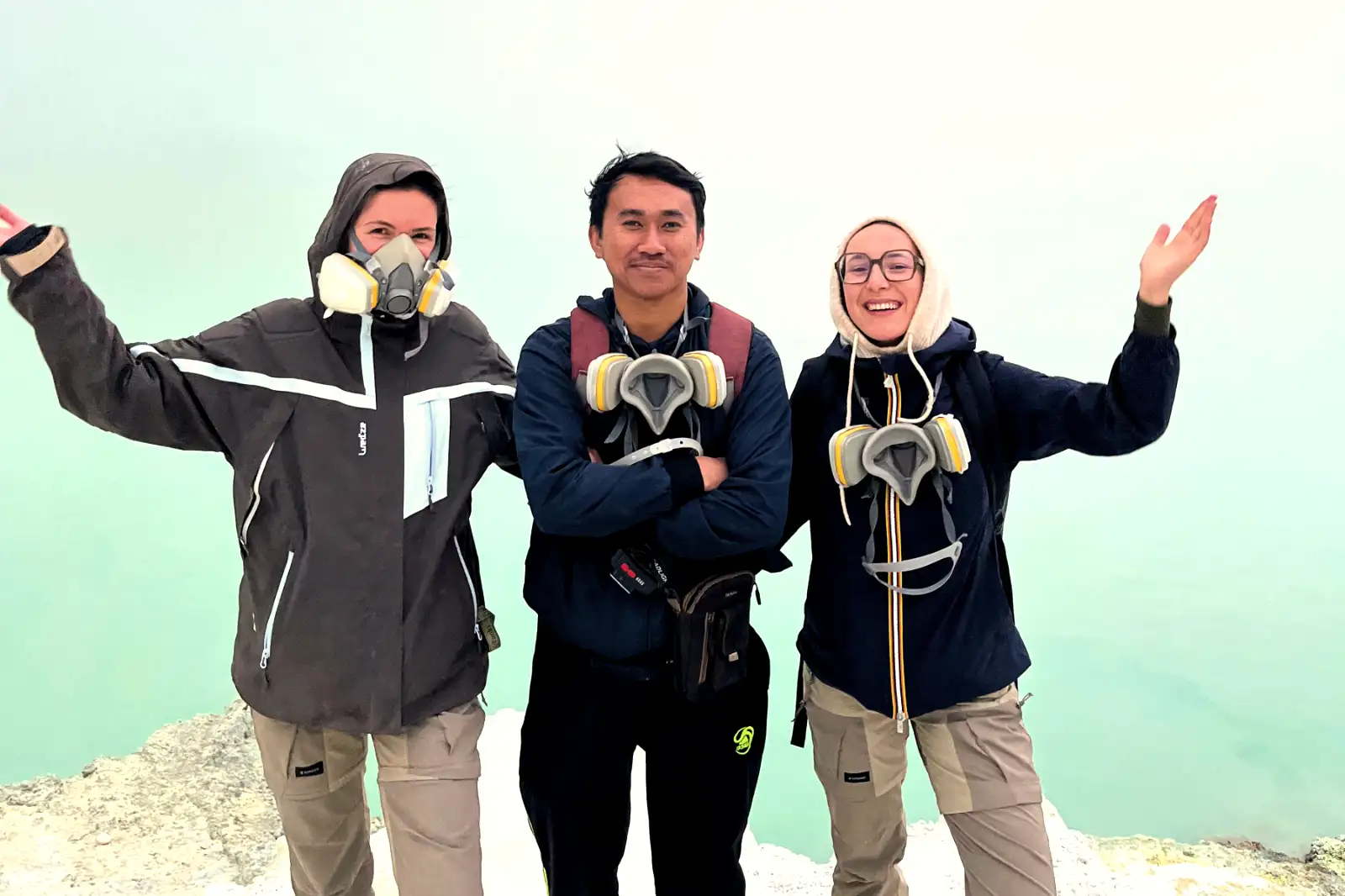 Sulfur smoke and the rocky rim of Ijen Crater